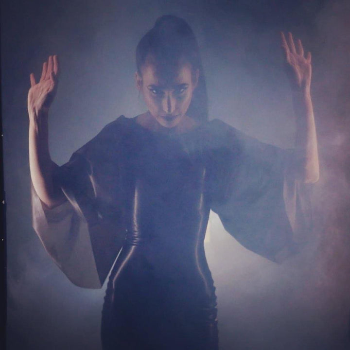 Latex gown made for the video. Directed by Videodrome, effects make-up by H Galipo.