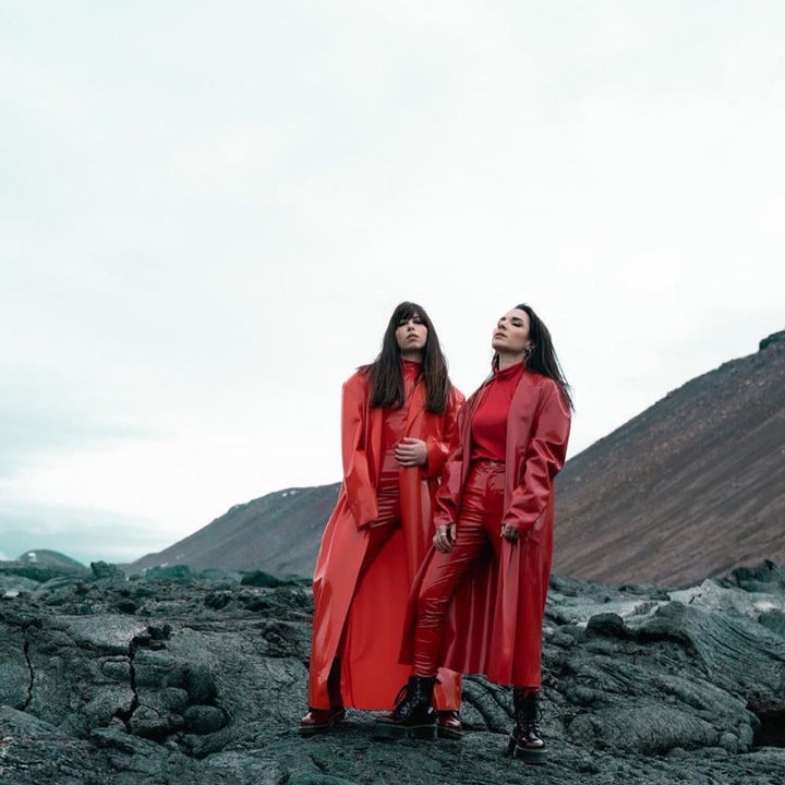 Custom red and transparent red trench coats, shot in Iceland. Styling by Star Burleigh, photograph by Graziano Piazza.